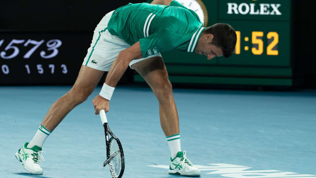 Novak Djokovic smashes his racket at the Australian Open